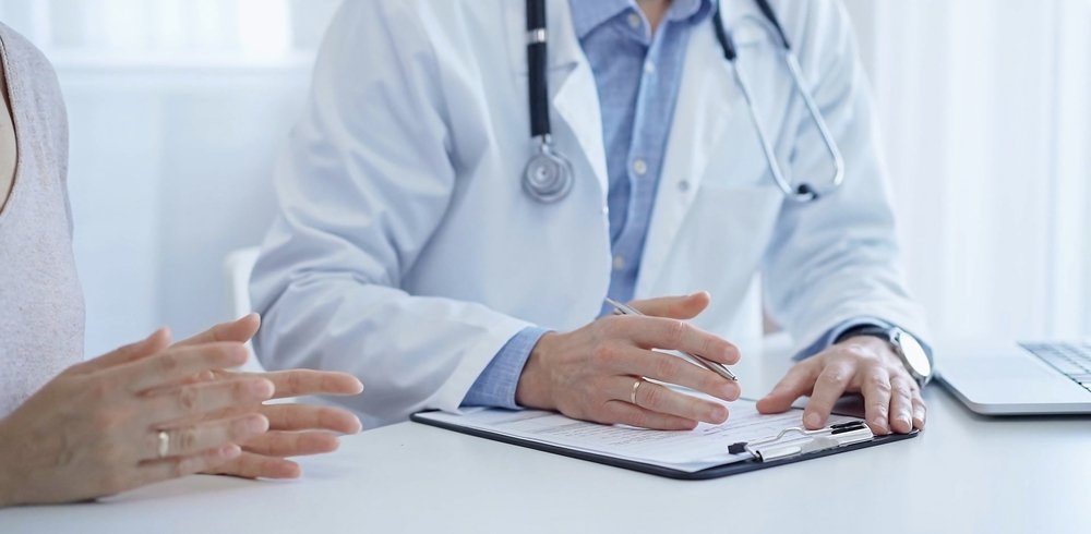 Patient consultation with doctor in white coat - Private GP